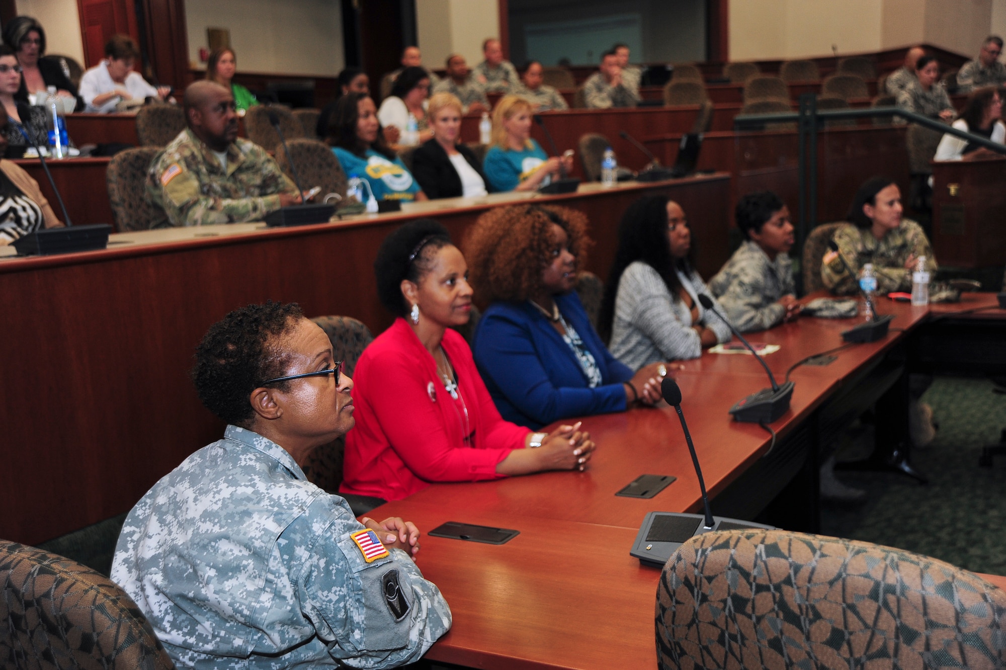 Six voluntary jury members listen attentively as evidence and testimonies are presented during the first-ever Green Dot mock trial, April 18, 2016, at MacDill Air Force Base, Fla. The two-hour mock trial is a reenactment of a real-life sexual assault trial in which the audience was able to participate and determine the verdict. (U.S. Air Force photo by Senior Airman Jenay Randolph)