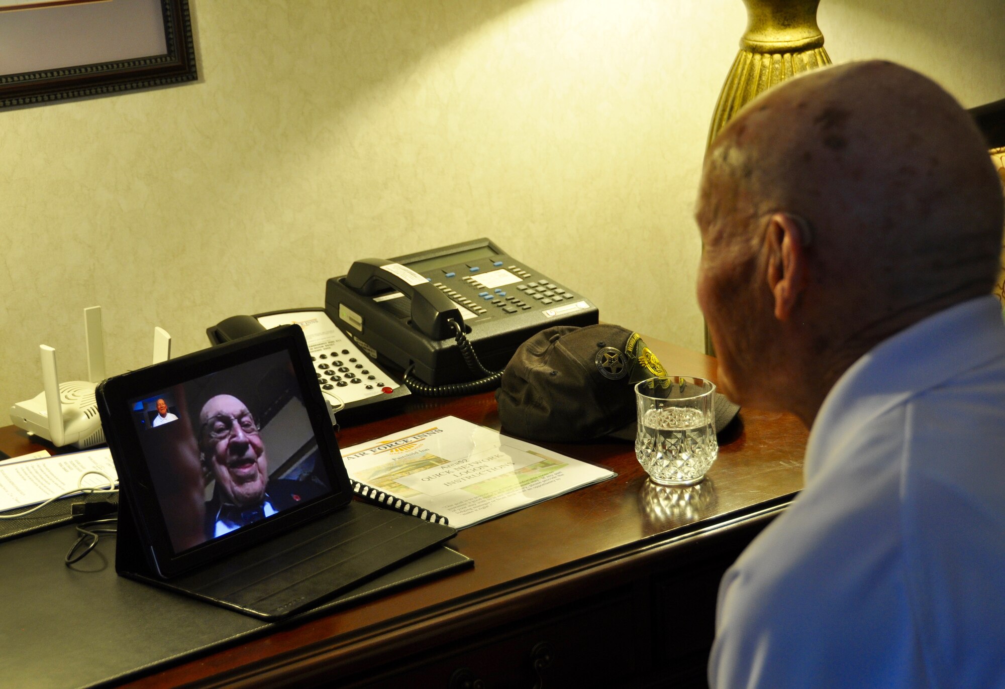Staff Sgt. David Thatcher video chats with retired Lt. Col. Richard Cole April 18, 2016 at Fairchild Air Force Base, Wash. Cole was the copilot of Aircraft No. 1, he and Thatcher are the only two surviving Doolittle Raiders. (U.S. Air Force photo/2nd Lt. Shelley Gregory)