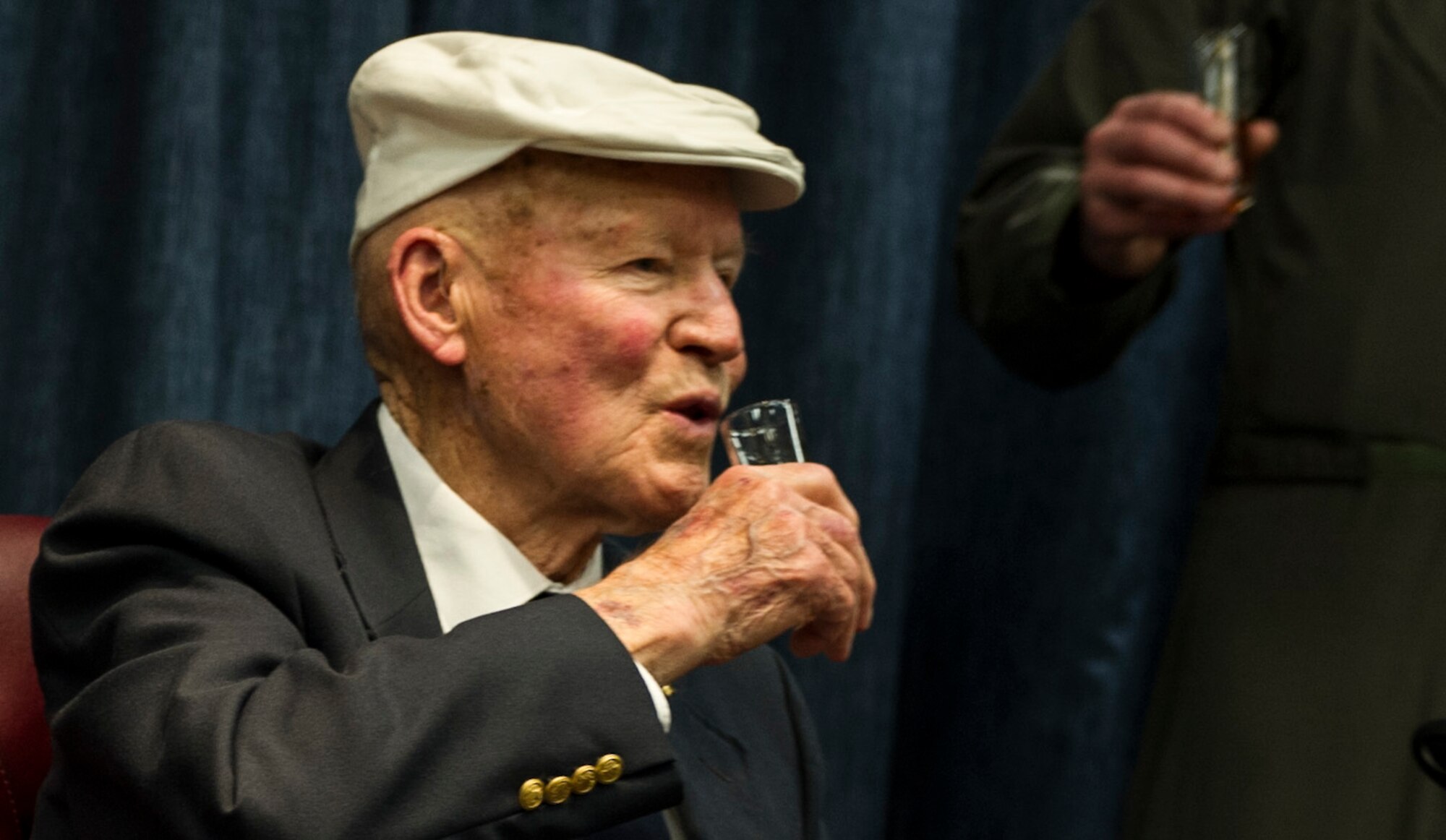 Army Air Force Staff Sgt. David Thatcher leads a toast in remembrance of all the members of the Doolittle Raid April 18, 2016, at Fairchild Air Force Base, Wash. All 80 of the Doolittle Raiders received the Distinguished Flying Cross for completion of the mission. 