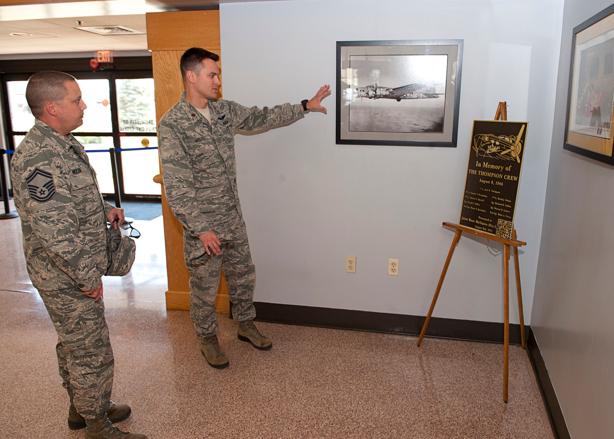 Maj. Mike Wells and Senior Master Sgt. Brian Nolan, 305th Air Mobility Wing's Commander's Action Group, discuss the construction plans of a new display in the Passenger Terminal memorializing a B-17 aircraft, the Chowhound, that was shot down in WWII. As the members of the CAG, Wells and Nolan coordinate and organize a variety of wing-sponsored events throughout the year, including the Flight Commander's Course, professional development events, wing runs, strategic off-sites, and many others. (U.S. Air Force photo by Christian DeLuca/released)
