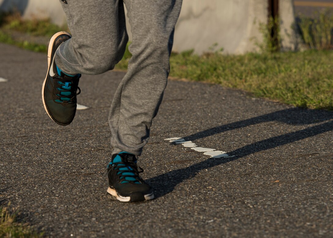 A runner participates in the second annual Sexual Assault Prevention and Response Program (SAPR) Awareness 5K run at Langley Air Force Base, Va., April 15, 2016. The SAPR 5K run promoted SAPR education and resources for U.S. Service members. (U.S. Air Force photo by Airman 1st Class Derek Seifert)
