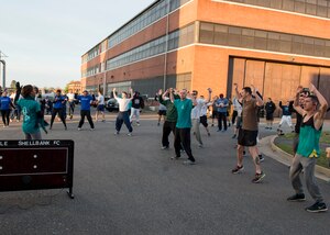 Runners stretch before a Sexual Assault Prevention and Response Program (SAPR) 5K run at Langley Air Force Base, Va., April 15, 2016. April is designated as Sexual Assault Awareness Month, with events throughout the month to bring awareness and education to the community. (U.S. Air Force photo by Airman 1st Class Derek Seifert)