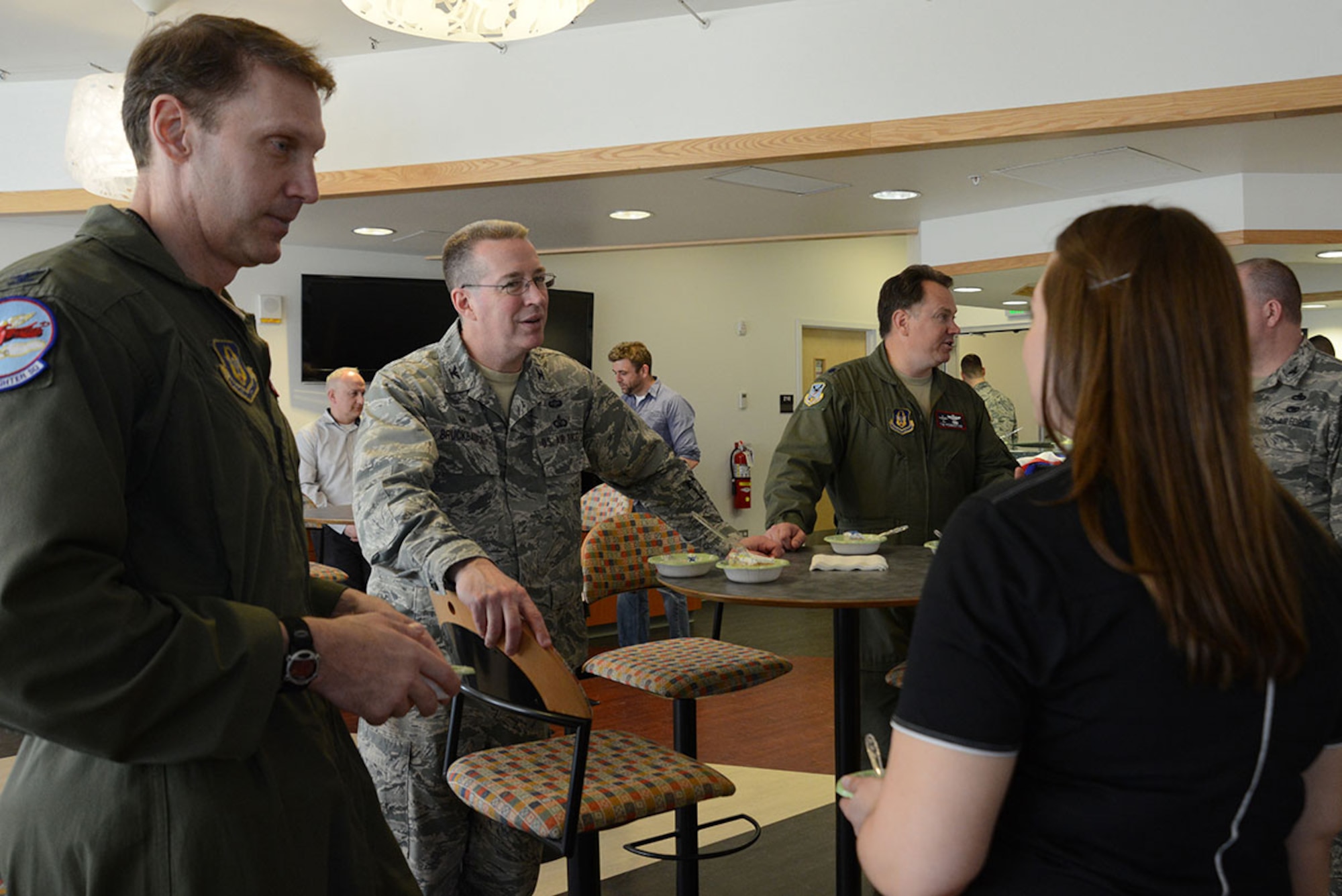 Air Force Col. Brian Bruckbauer (center), Joint Base Elmendorf-Richardson and 673d Air Base Wing commander, and Air Force Col. David Piffarerio (left), 477th Fighter Group commander, talk to Ann Jarvis (right), USO Alaska center operations and programs manager, and other party participants at the Air Force Reserve 68th birthday celebration at Joint Base Elmendorf-Richardson, Alaska, April 14, 2016. The theme was “Stationed Locally, Serving Globally” in honor of more than 69,000 citizen Airmen stationed in more than 66 communities throughout the United States and overseas. Citizen Airmen serve globally in every combatant command in air, space and cyberspace. (U.S. Air Force photo by Airman 1st Class Christopher R. Morales)