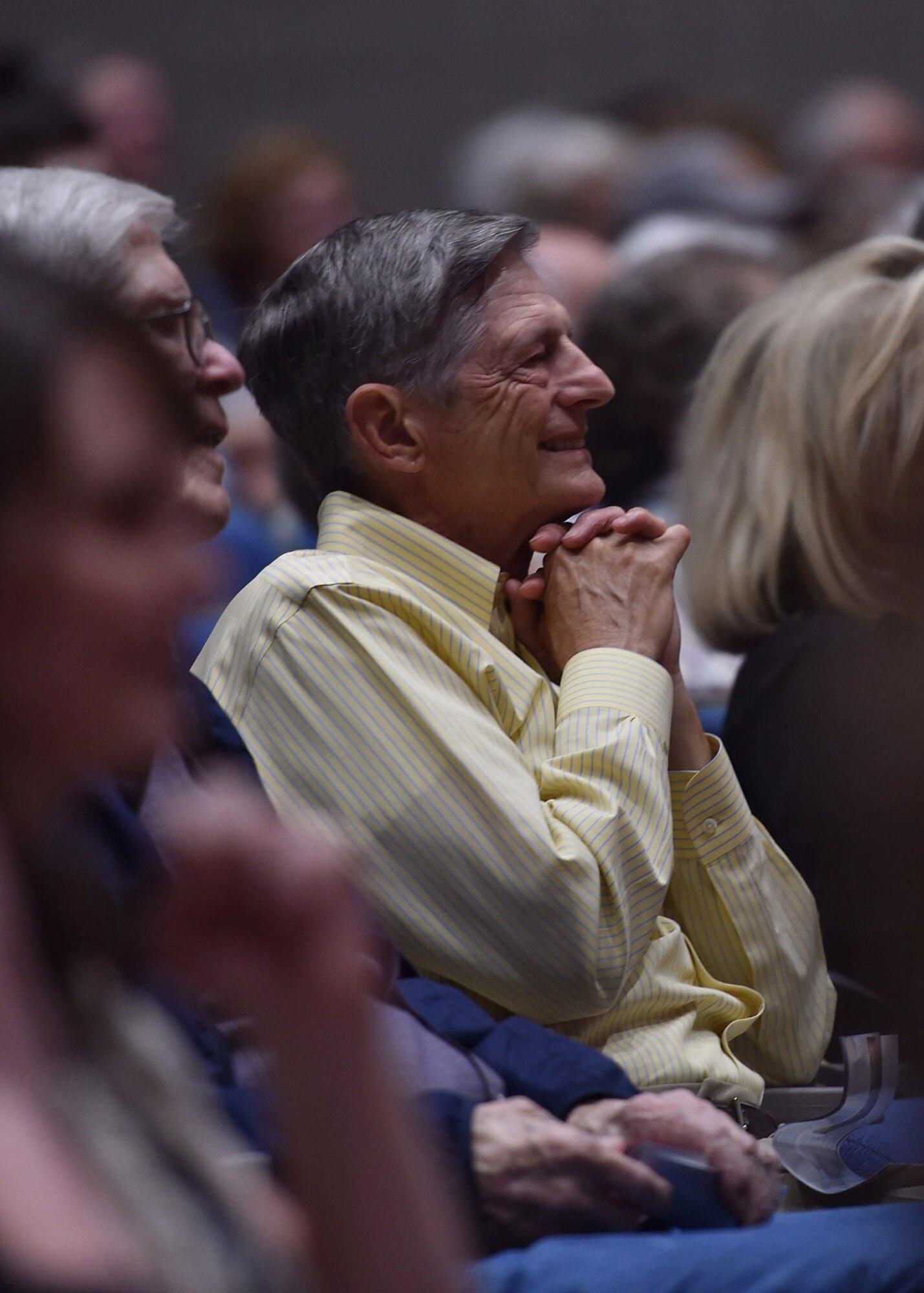 A member of the audience looks on during the U.S. Air Force Concert Band and Singing Sergeants performance at Conway High School in Conway, Ark., April 6, 2016. The bands performed across five states during a 12 day spring tour. (U.S. Air Force photo by Senior Airman Dylan Nuckolls/Released)