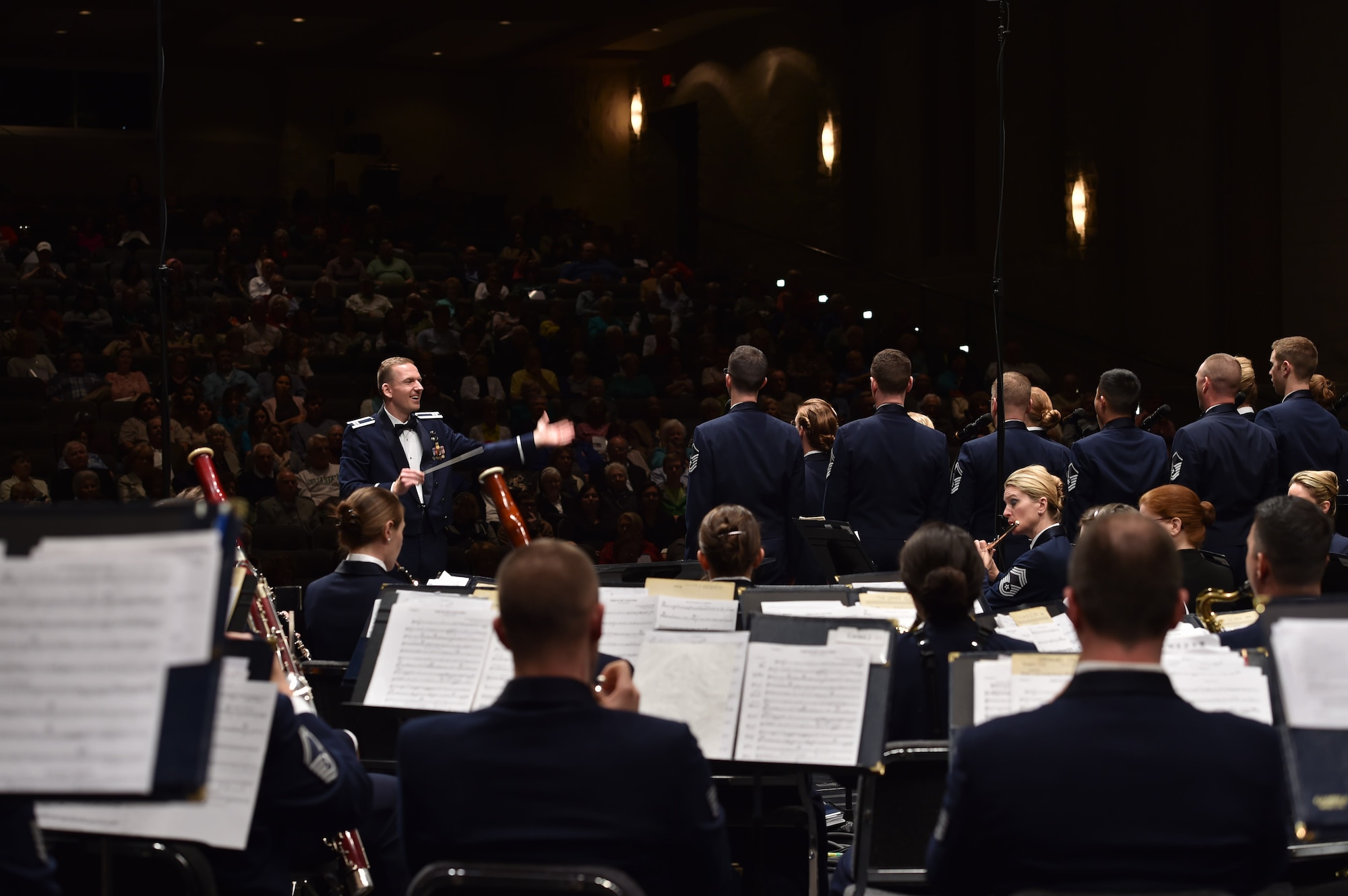 Capt. Joseph Hansen, U.S. Air Force Singing Sergeants officer in charge, conducts during a U.S. Air Force Concert Band and Singing Sergeants performance at Delta State University, in Cleveland, Miss., April 13, 2016. The bands performed across five states during a 12 day spring tour. (U.S. Air Force photo by Senior Airman Dylan Nuckolls/Released)