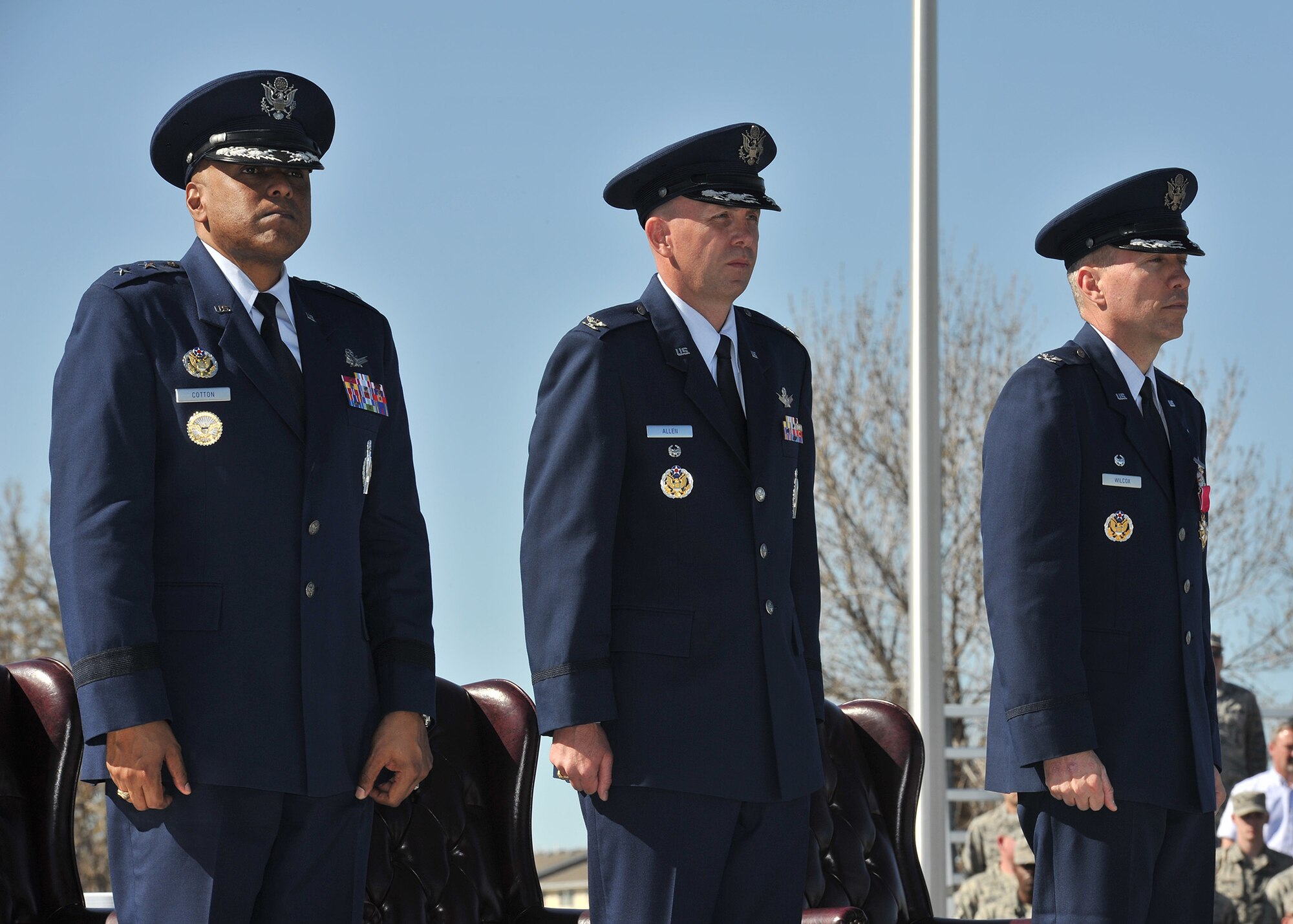 Maj. Gen. Anthony J. Cotton, 20th Air Force commander, Col. Ronald G. Allen, Jr., 341st Missile Wing commander, and Col. John T. Wilcox II, previous 341 MW commander, rise for the Air Force song at the completion of the 341 MW change of command ceremony April 19, 2016, at Malmstrom Air Force Base, Mont. (U.S. Air Force photo/John Turner)