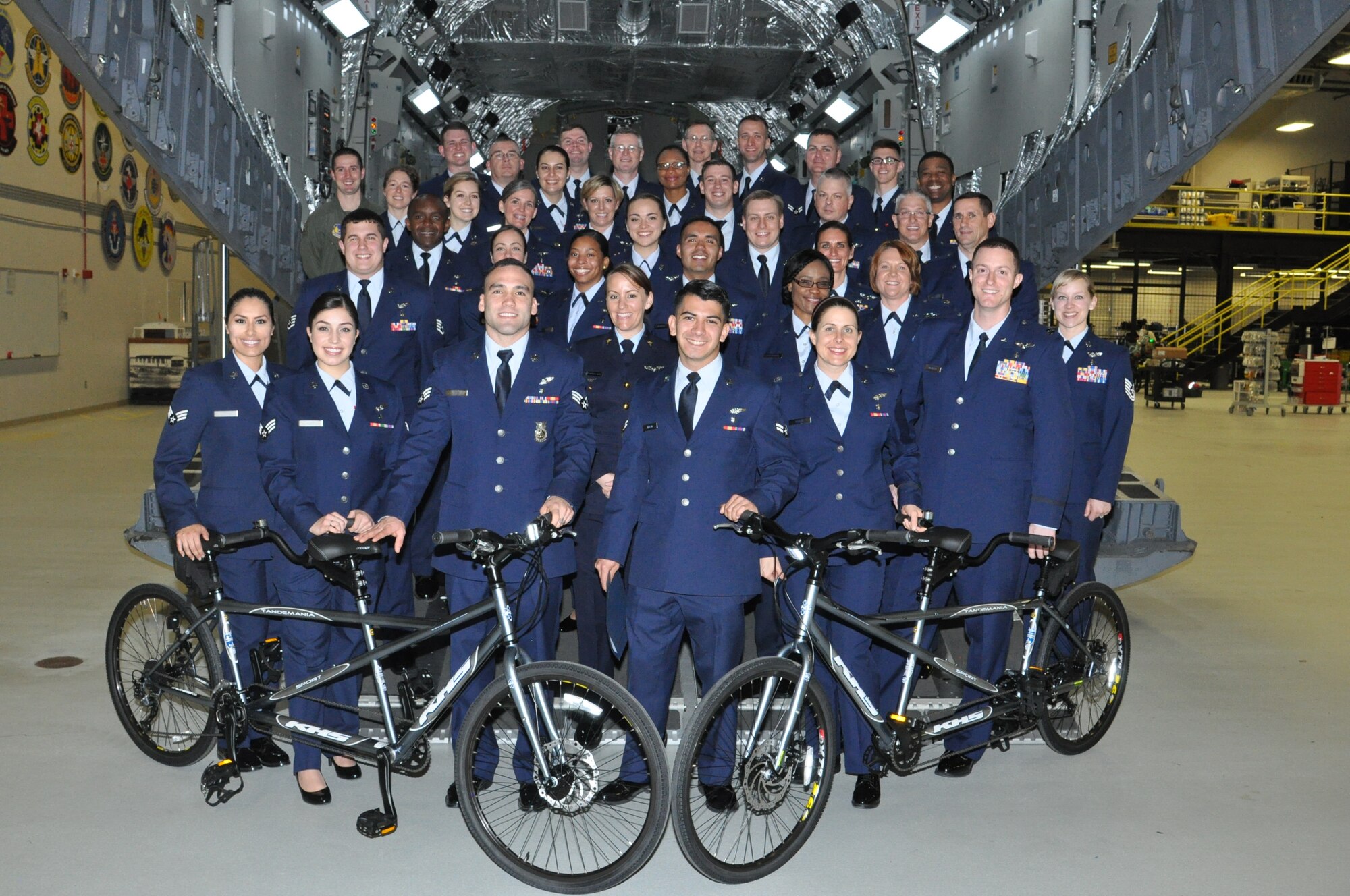 Students from the United States Air Force School of Aerospace Medicine Flight Nurse and Aeromedical Evacuation Technician Course, Class 2016D shown with two tandem bicycles the class donated to the Ohio State School for the Blind. Twenty-nine students graduated with the class. One of the bikes will be donated on behalf of and in honor of the USAFSAM cadre. The second bike will be donated in honor of two students in the class who unexpectedly lost family members during the time the class was in session. (U.S. Air Force photo/Bryan Ripple)