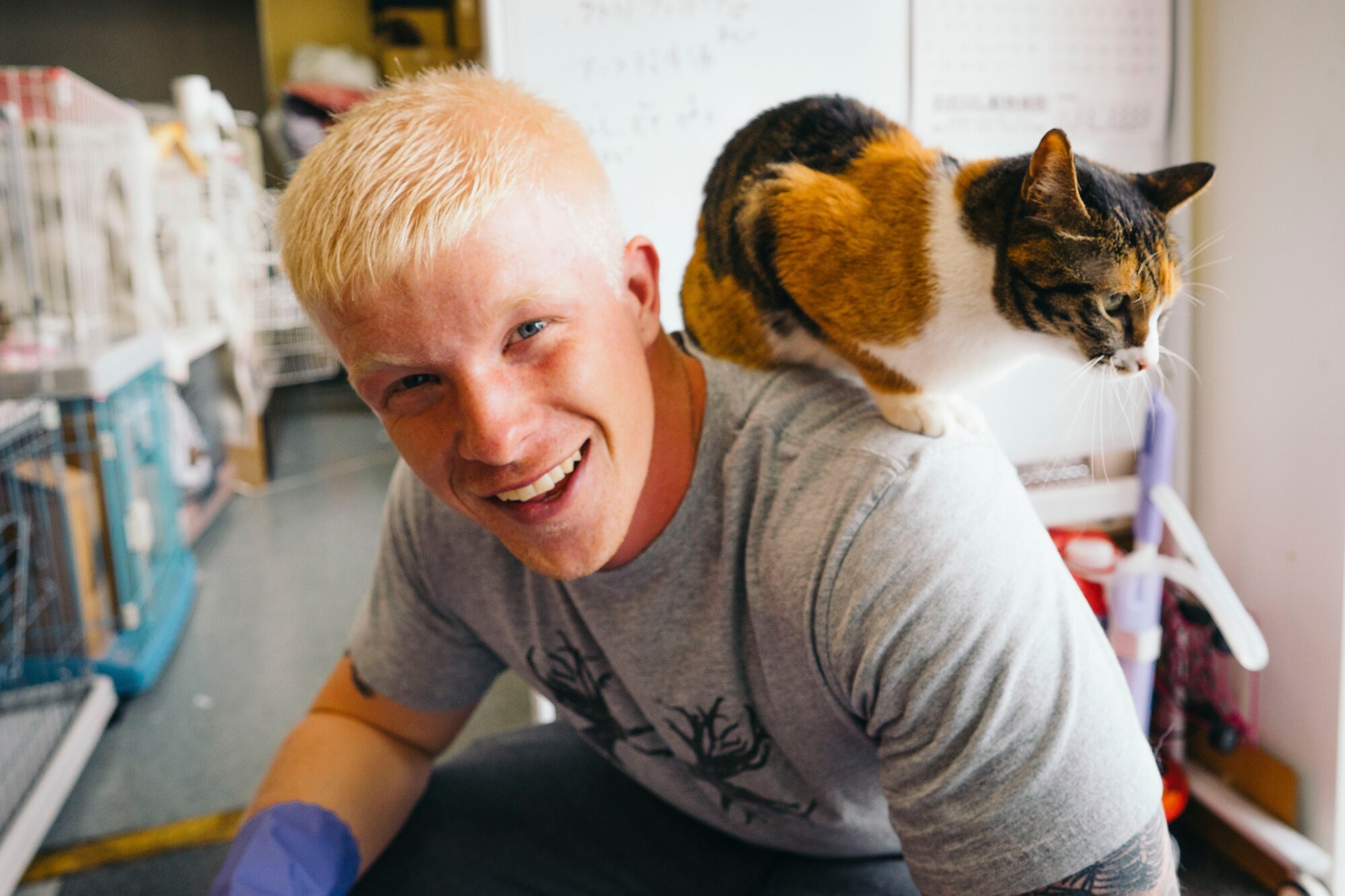 Airman Spencer Patton, 374th Civil Engineer Squadron emergency management, prepares to clean a cat cage at an animal shelter in Akishima, Japan, April 16, 2016. By volunteering at the shelter, Airmen not only had an opportunity to help animals, but also forge a stronger bond with the people within their local community. (U.S. Air Force photo by Senior Airman Delano Scott/Released)