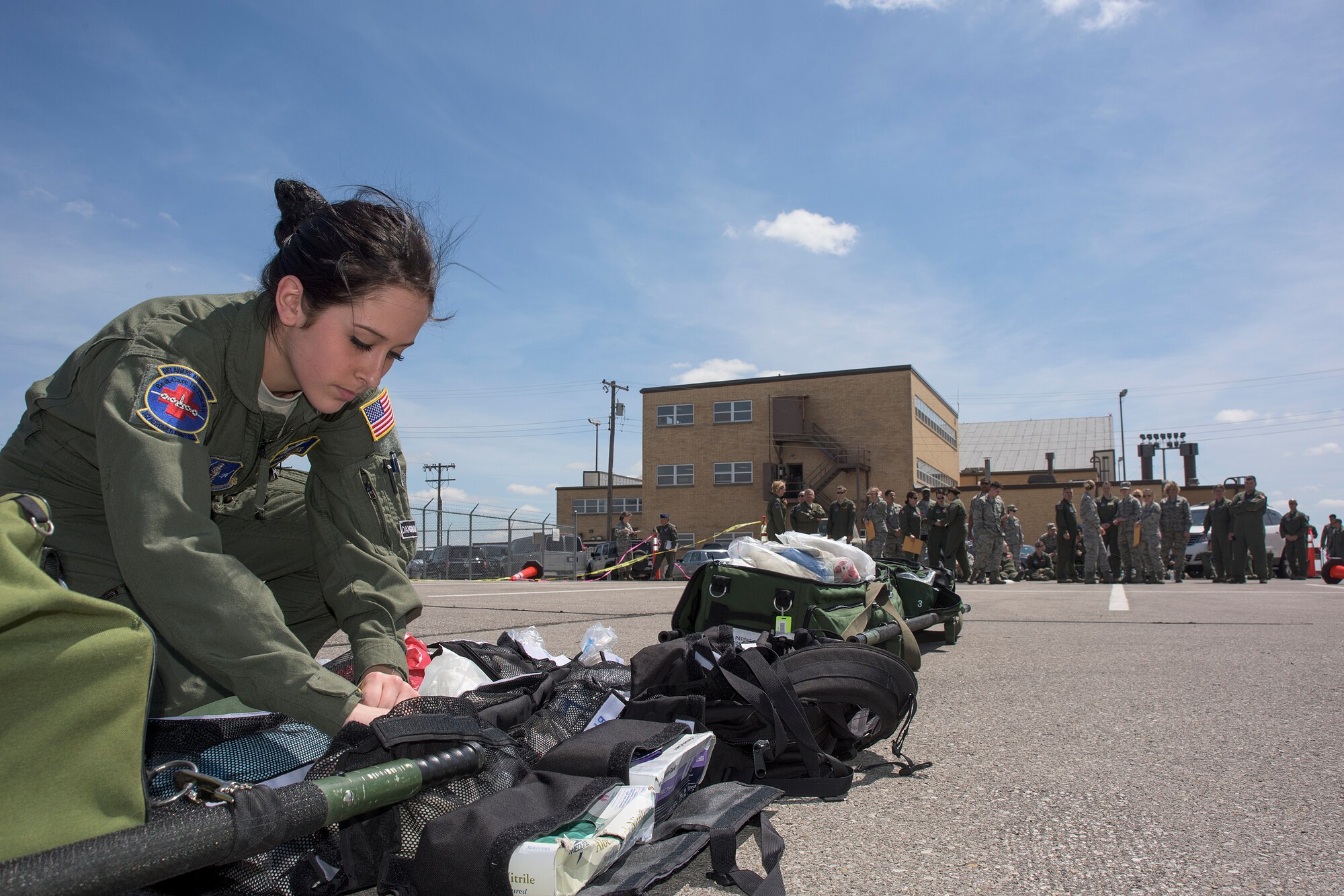 U.S. Air Force Senior Airman First Class Dominique Dimatteo, assigned to the 142nd Aeromedical Evacuation Squadron, digs through an equipment bag during a training event on Will Rogers Air National Guard Base, Okla., April 15, 2016. (U.S. Air National Guard photo by Tech. Sgt. Caroline Essex/Released)