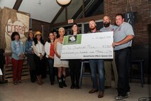 Maxwell Gunter Officer Spouse Club members present a $2,500 check to the Shepherd’s Men of the Shepherd Center for Traumatic Brain Injury, during the annual fund raising silent auction and dinner, April 16, 2016, Maxwell Air Force Base, Ala. The money donated to the organization will go toward providing care to U.S. veterans who have sustained a traumatic brain injury or post-traumatic stress disorder. (U.S. Air Force photo/Airman 1st Class Alexa Culbert)