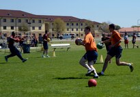 Students run to destroy an opposite team’s base during a game of FLEX ball at Richey Field on Maxwell Air Force Base, Ala., March 21, 2016. Each flight has a simulated joint air relations center, which gives a strategy to the students of how to execute a plan. The students execute the plan and decide what worked or did not succeed. (U.S. Air Force photo/Senior Airman Tammie Ramsouer) 