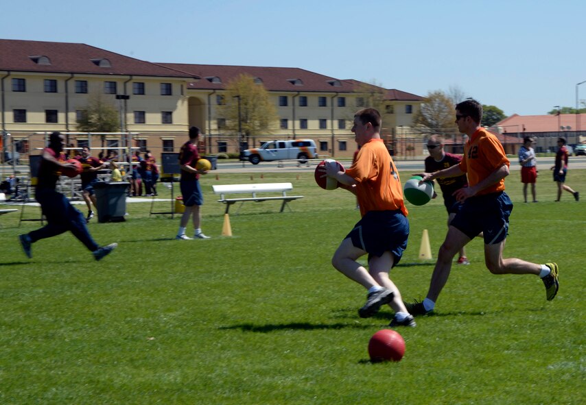 Students run to destroy an opposite team’s base during a game of FLEX ball at Richey Field on Maxwell Air Force Base, Ala., March 21, 2016. Each flight has a simulated joint air relations center, which gives a strategy to the students of how to execute a plan. The students execute the plan and decide what worked or did not succeed. (U.S. Air Force photo/Senior Airman Tammie Ramsouer) 
