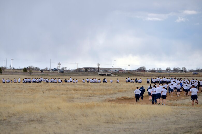 Airmen with the 50th Space Wing participate in the Warfit Run at Schriever Air Force Base, Colorado, Wednesday, April 13, 2016. The wing holds a wing run every month from March to November. (U.S Air Force photo/Dennis Rogers)