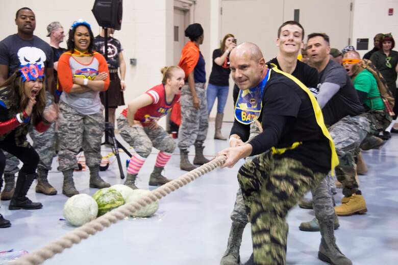 The team composed of Wing Staff Agencies and 50th Security Forces Squadron win the tug of war during the 2016 Combat Dining Out at Schriever Air Force Base, Colorado, Friday, April 15, 2016. The WSA won the obstacle course and the tug of war. (U.S. Air Force photo/Tech. Sgt. Julius Delos Reyes)