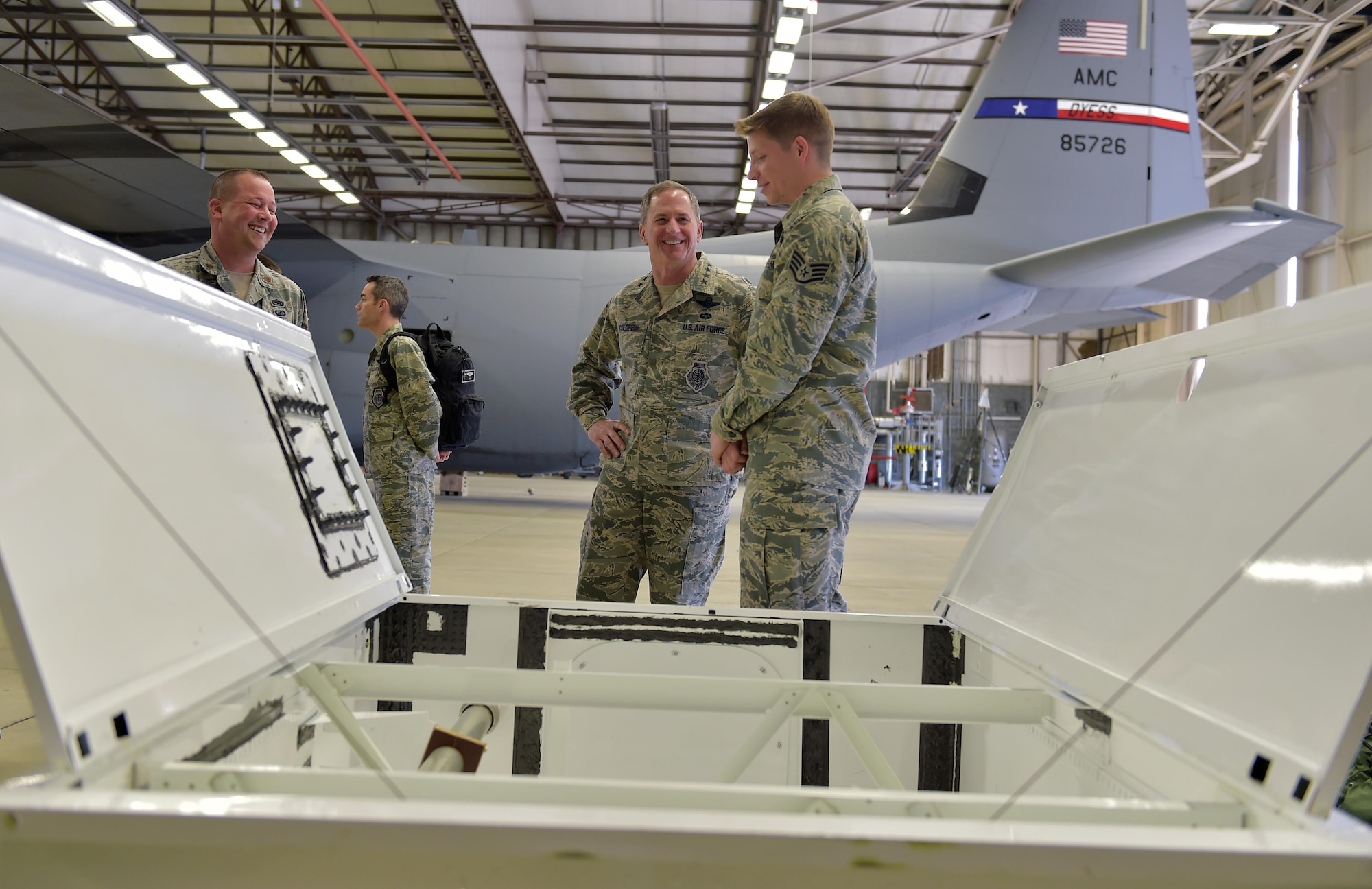 U.S. Air Force Vice Chief of Staff Gen. David L. Goldfein speaks with Staff Sgt. Gregory Beach, 86th Maintenance Squadron member, during his visit to Ramstein Air Base, Germany, 18 April 2016. Beach gave Goldfein a brief on a unique innovation developed and implemented locally where a filing cabinet was converted into fuel tank trainer. The fuel trainer was constructed out of the filing cabinet, expended parts, sheet metal and fasteners; the trainer eliminates exposure to hazardous fuel tanks on operational aircraft and without this innovative tool the unit would need to gain access to a wing section of a C-130J Hercules to ensure personnel remain trained. (U.S. Air Force photo/1st Lt. Clay Lancaster)