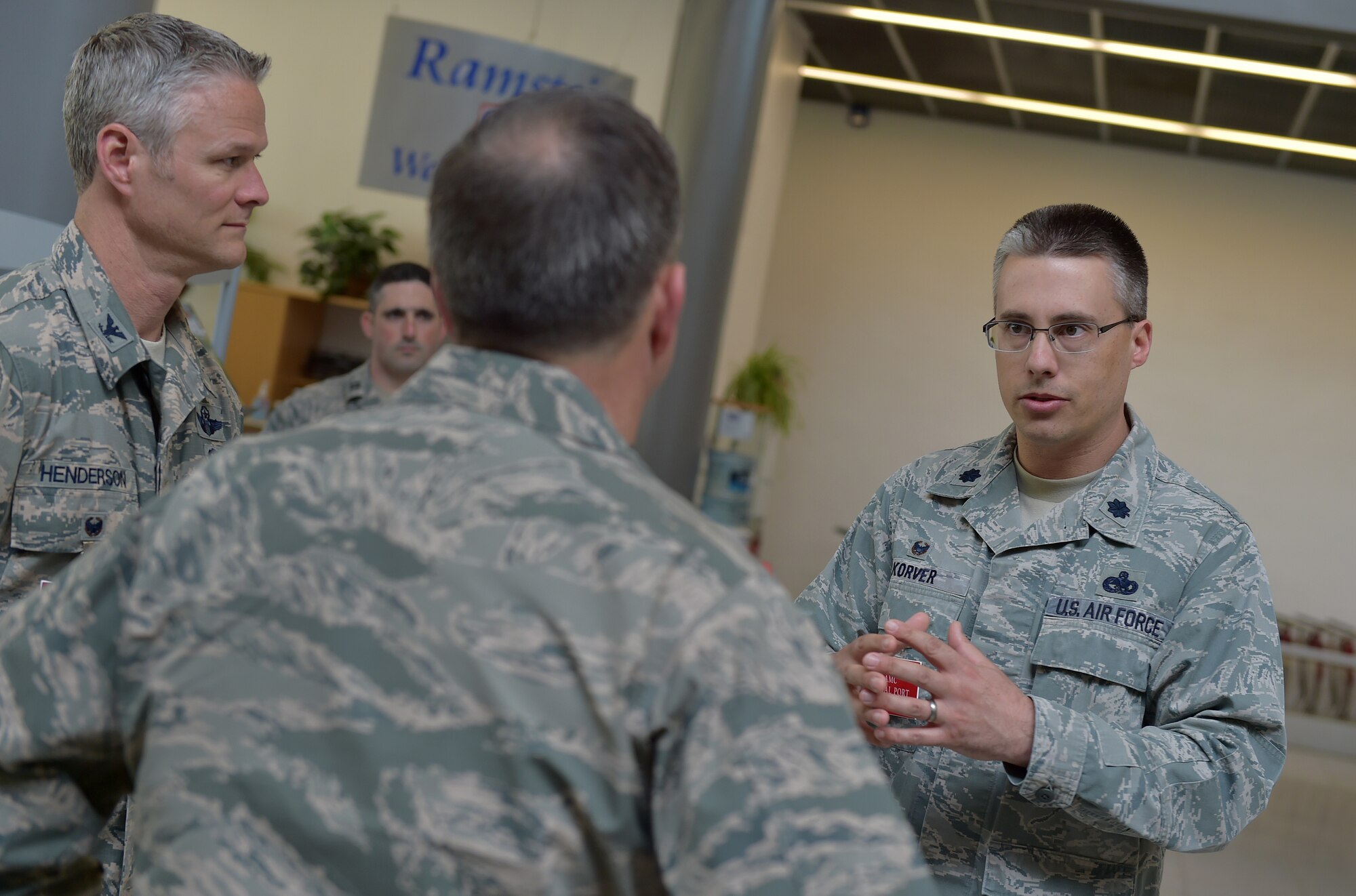 U.S. Air Force Lt. Col. Kyle Korver, 721st Aerial Port Squadron commander, and Col. Charles Henderson, 521st Air Mobility Operations Wing vice commander, brief Vice Chief of Staff Gen. David L. Goldfein during his visit to Ramstein Air Base, Germany, 18 April 2016. Korver, and other members of AMOW and the 86th Airlift Wing, gave Goldfein a walking tour of the passenger terminal where less a month prior the installation played a critical role in ensuring more than 700 dependents were cared for during the ordered departure of DoD civilians and dependents from Turkey. Goldfein and his wife, Dawn, visited the installation to gain insight into Ramstein mission sets and the innovative ways Airmen are making the mission happen in U.S. Air Forces in Europe. (U.S. Air Force photo/1st Lt. Clay Lancaster)