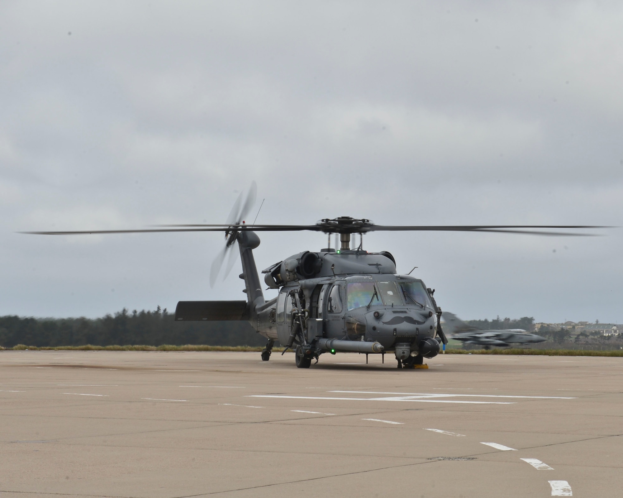 A HH-60G Pave Hawk prepares to taxi the runway during Joint Warrior 2016 at Royal Air Force Lossiemouth, Scotland, April 13, 2016. Joint Warrior 2016 allows crews the opportunity to train on various terrains that aren't available at home station. (U.S. Air Force photo/Senior Airman Nigel Sandridge)