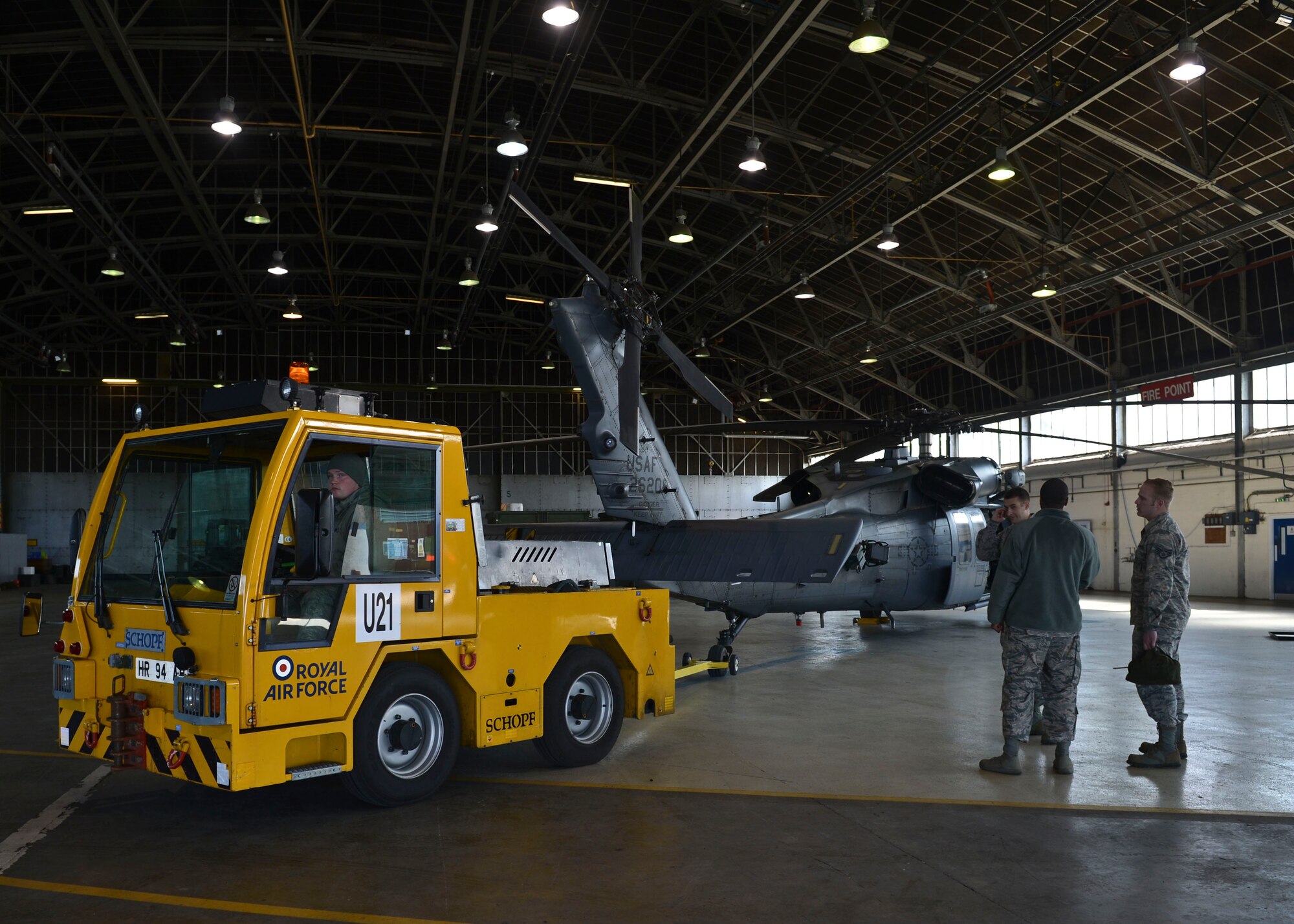 Airmen from the 748th Aircraft Maintenance Squadron prepare an HH-60G Pave Hawk to be towed to the flightline during Joint Warrior 2016 at Royal Air Force Lossiemouth, Scotland, April 13, 2016. The purpose of Joint Warrior, a three-week exercise, is to enhance the capabilities of its personnel for real- world events through various forms of search and rescue training. (U.S. Air Force photo/Senior Airman Nigel Sandridge)