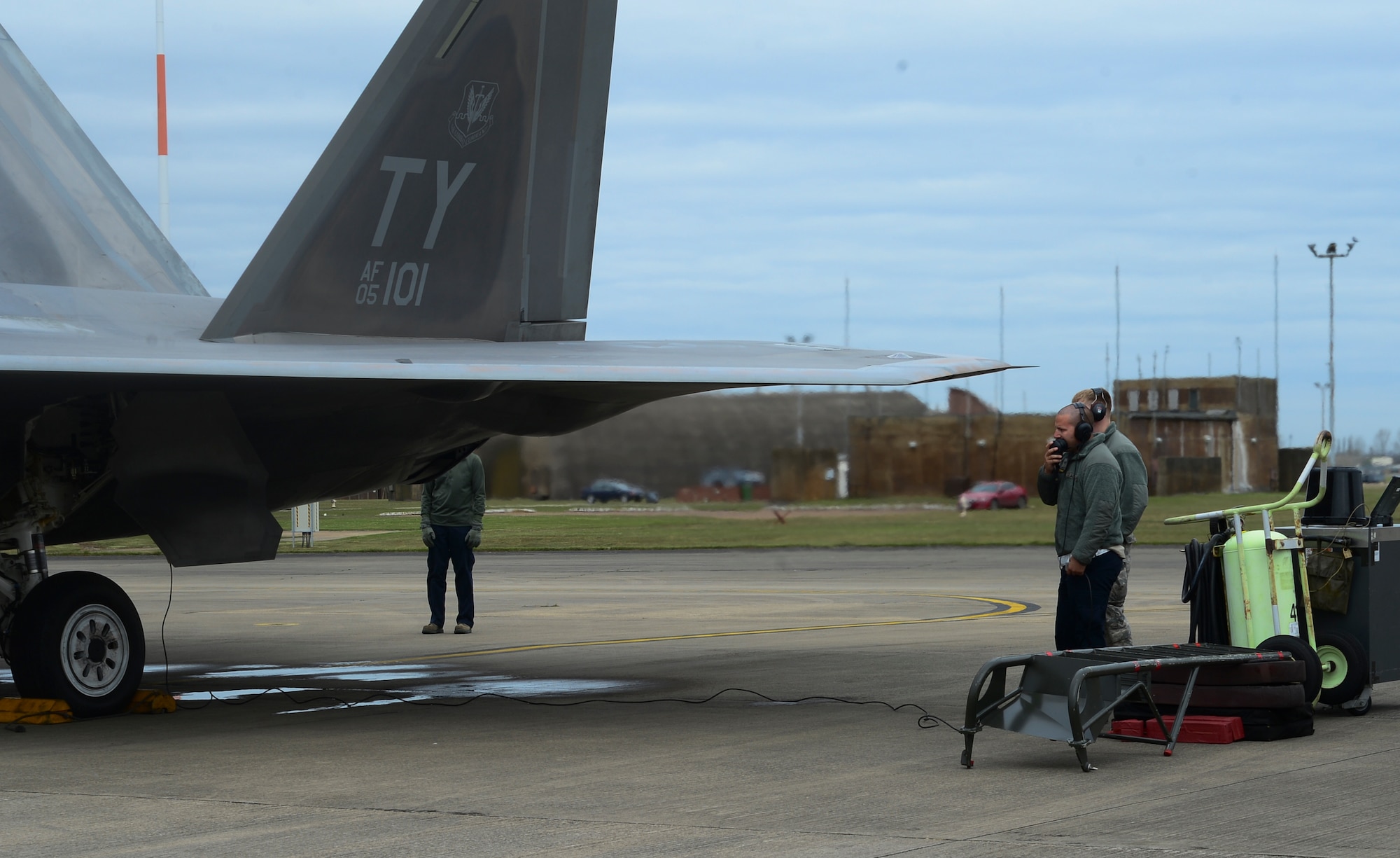 Maintenance Airmen assigned to the 325th Maintenance Squadron, Tyndall Air Force Base, Fla., communicate with an F-22 Raptor pilot before takeoff from Royal Air Force Lakenheath, England, April 18, 2016. The aircraft arrival marks the second time the U.S. European Command has hosted a deployment of F-22 aircraft in the EUCOM Area of Responsibility. This is the largest deployment of F-22’s to Europe and the first to the U.K. (U.S. Air Force photo by Senior Airman Dawn M. Weber/Released)