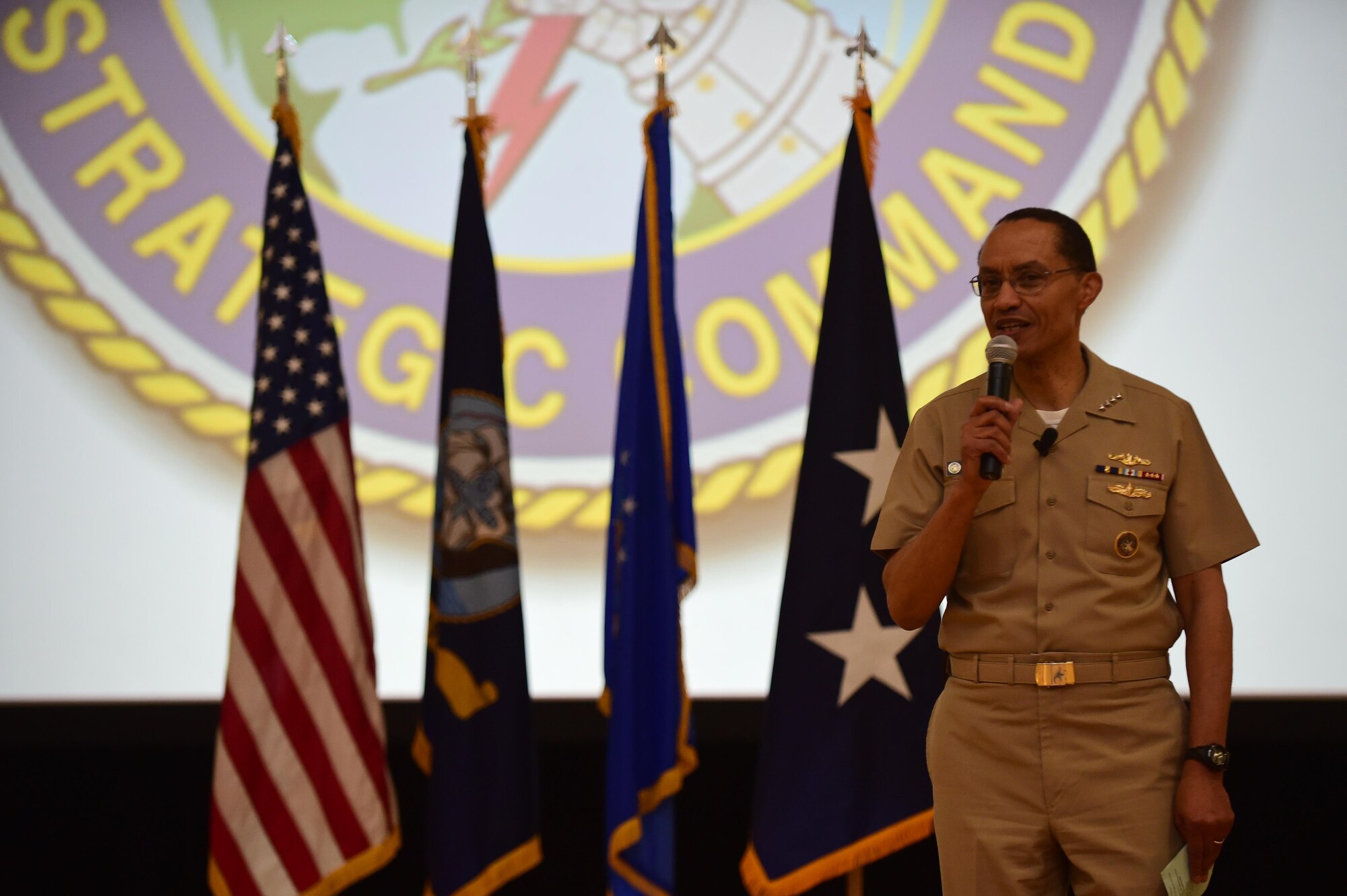U.S. Navy Adm. Cecil D. Haney, U.S. Strategic Command (USSTRATCOM) commander, provides remarks during an award ceremony honoring the 460th Space Wing at Buckley Air Force Base, Colo., April 15, 2016. During the ceremony, Haney and U.S. Air Force Lt. Gen. (Ret.) Robert Hinson, Strategic Command Consultation (SCC) Committee chairman (not pictured), presented the 2015 Omaha Trophy, Global Operations category, to Airmen assigned to the 460th Space Wing in recognition of their support of the command’s strategic deterrence mission and their dedication to providing a safe, secure, effective and ready deterrent force. The Omaha Trophy, which was originally created by the SCC in 1971, was presented to the wing in recognition of their contributions to USSTRATCOM's global strategic missions. At the time, a single trophy was presented annually as a token of appreciation to USSTRATCOM's best wing. Since then, the tradition has evolved to unit-level awards that recognize the command's premier Intercontinental Ballistic Missile wing, ballistic missile submarine, strategic bomber wing and global operations (space/cyberspace) unit. This year, a new category was added to include the combatant command's top strategic aircraft wing. (U.S. Air Force photo by Airman 1st Class Gabrielle Spradling)