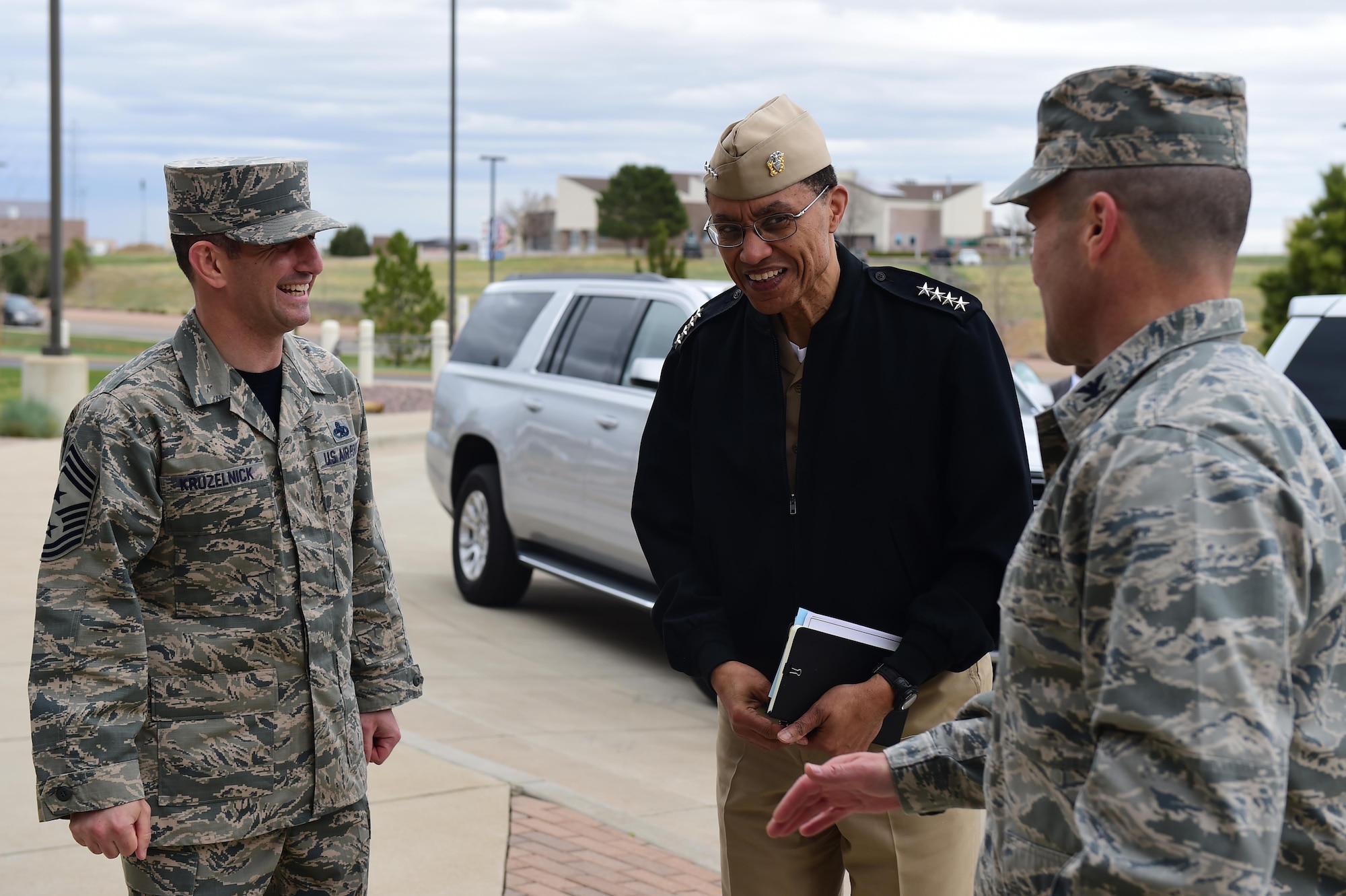 U.S. Navy Adm. Cecil D. Haney, U.S. Strategic Command (USSTRATCOM) commander (center), is greeted by U.S. Air Force Col. John Wagner, 460th Space Wing commander (right), and U.S. Air Force Chief Master Sgt. Brian Kruzelnick, 460th Space Wing command chief master sergeant, during his visit to Buckley Air Force Base, Colo., April 15, 2016. While there, Haney and U.S. Air Force Lt. Gen. (Ret.) Robert Hinson, Strategic Command Consultation (SCC) Committee chairman (not pictured), presented the 2015 Omaha Trophy, Global Operations category, to Airmen assigned to the 460th Space Wing in recognition of their support of the command’s strategic deterrence mission and their dedication to providing a safe, secure, effective and ready deterrent force. The Omaha Trophy, which was originally created by the SCC in 1971, was presented to the wing in recognition of their contributions to USSTRATCOM's global strategic missions. At the time, a single trophy was presented annually as a token of appreciation to USSTRATCOM's best wing. Since then, the tradition has evolved to unit-level awards that recognize the command's premier Intercontinental Ballistic Missile wing, ballistic missile submarine, strategic bomber wing and global operations (space/cyberspace) unit. This year, a new category was added to include the combatant command's top strategic aircraft wing. (U.S. Air Force photo by Airman 1st Class Gabrielle Spradling)