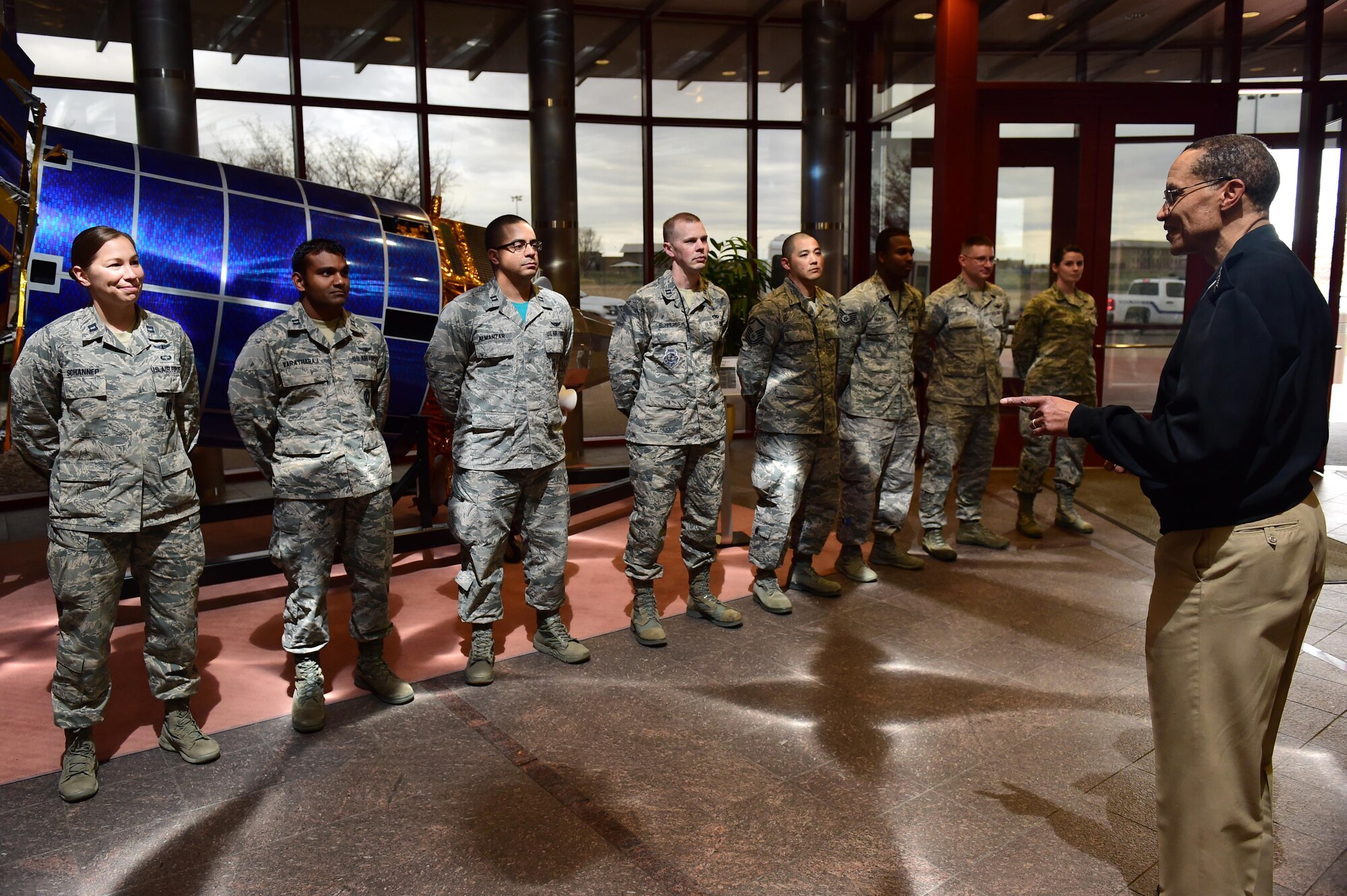 U.S. Navy Adm. Cecil D. Haney, U.S. Strategic Command (USSTRATCOM) commander (right), speaks with members of the 460th Space Wing during his visit to Buckley Air Force Base, Colo., April 15, 2016. While there, Haney and U.S. Air Force Lt. Gen. (Ret.) Robert Hinson, Strategic Command Consultation (SCC) Committee chairman (not pictured), presented the 2015 Omaha Trophy, Global Operations category, to Airmen assigned to the 460th Space Wing in recognition of their support of the command’s strategic deterrence mission and their dedication to providing a safe, secure, effective and ready deterrent force. The Omaha Trophy, which was originally created by the SCC in 1971, was presented to the wing in recognition of their contributions to USSTRATCOM's global strategic missions. At the time, a single trophy was presented annually as a token of appreciation to USSTRATCOM's best wing. Since then, the tradition has evolved to unit-level awards that recognize the command's premier Intercontinental Ballistic Missile wing, ballistic missile submarine, strategic bomber wing and global operations (space/cyberspace) unit. This year, a new category was added to include the combatant command's top strategic aircraft wing. (U.S. Air Force photo by Airman 1st Class Gabrielle Spradling)