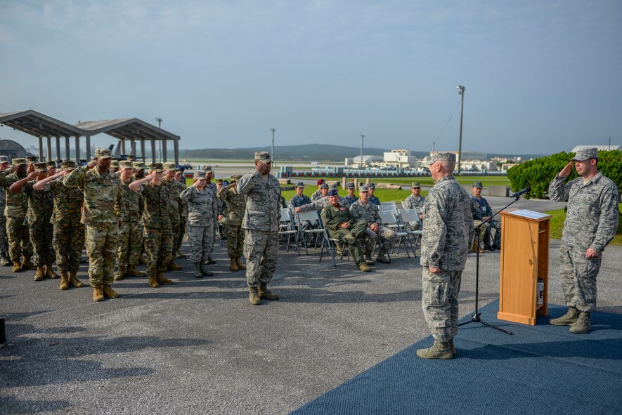 Members of the 623rd Aircraft Control Squadron present the squadron’s first salute to Lt. Col. Daniel Biehl, 623 ACS commander, during a re-designation ceremony April 15, 2016, at Kadena Air Base, Japan. The squadron is getting more Airmen with the introduction of the Sector Interface Control Cell. This increase will take their flight of 24 to a squadron of 36. (U.S. Air Force photo by Senior Airman Stephen G. Eigel)