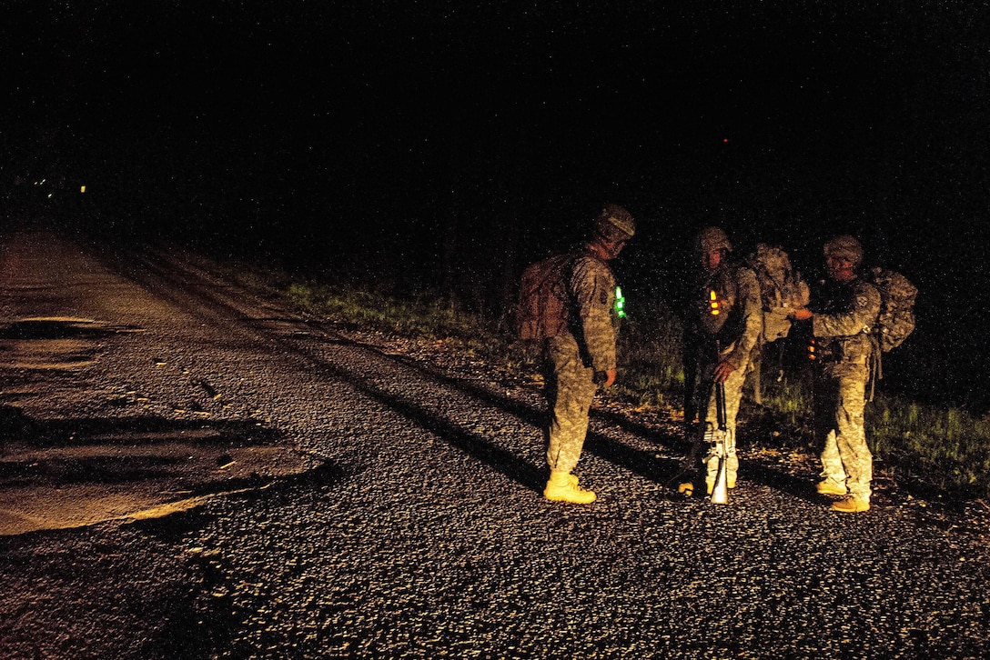 Soldiers prepare for a 12 mile ruck march at McCrady Training Center in Eastover, S.C. April 5, 2016. The soldiers are assigned to the Florida and South Carolina Army National Guard’s 218th Regiment. The Florida guardsmen are retraining and transitioning to become combat engineers. South Carolina Air National Guard photo by Tech. Sgt. Jorge Intriago