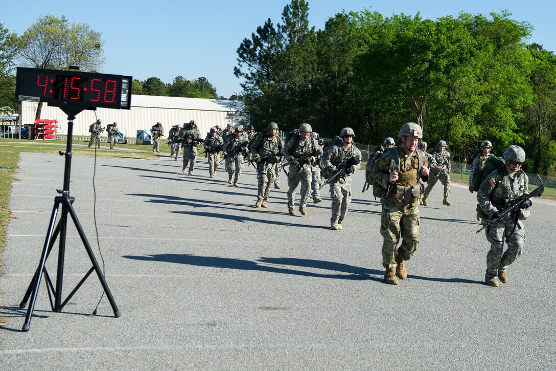 Soldiers cross the finish line after a 12 mile ruck march at McCrady Training Center in Eastover, S.C. April 5, 2016. South Carolina Air National Guard photo by Tech. Sgt. Jorge Intriago