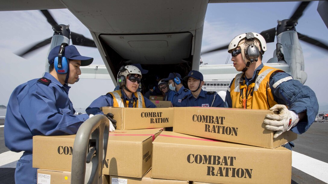 Japan Maritime Self Defense Force personnel, U.S. Navy sailors and U.S. Marines load supplies onto a U.S. Marine Corps MV-22B Osprey tiltrotor aircraft from Marine Medium Tiltrotor Squadron 265, 31st Marine Expeditionary Unit aboard the JS Hyuga, at sea, April 20, 2016. The supplies are in support of the relief effort after a series of earthquakes struck the island of Kyushu. The 31st MEU is the only continually forward-deployed MEU and remains the Marine Corps' force-in-readiness in the Asia-Pacific region.