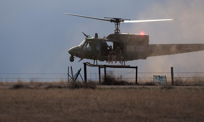 A 37th Helicopter Squadron UH-1N Bell Helicopter prepares to land and drop off 790th Missile Security Forces Squadron Tactical Response Force Airmen April 14, 2016, outside a launch facility in the F.E. Warren Air Force Base, Wyoming, Missile Complex. The 37th HS supports the mission of the 90th Missile Wing by providing aerial surveillance and emergency deployments of security response forces throughout the base and missile field. (U.S. Air Force photo by Senior Airman Brandon Valle)