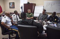 Command Sgt. Maj. Craig Owens (left), senior enlisted advisor, and Maj. Gen. Phillip Churn, commanding general of the 200th Military Police Command, meet with senior leaders of the Customs and Border Protection's National Frontline Recruitment Command, for a discussion about careers available to U.S. Army Reserve Soldiers, April 15, at the MP's headquarters, Fort Meade, Maryland. (U.S. Army photo by Master Sgt. Michel Sauret)