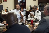Command Sgt. Maj. Craig Owens (left), senior enlisted advisor, and Maj. Gen. Phillip Churn, commanding general of the 200th Military Police Command, meet with senior leaders of the Customs and Border Protection's National Frontline Recruitment Command, for a discussion about careers available to U.S. Army Reserve Soldiers, April 15, at the MP's headquarters, Fort Meade, Maryland. (U.S. Army photo by Master Sgt. Michel Sauret)