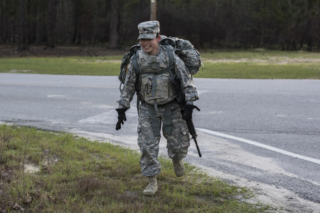 Spc. Kayla Bundy, 1st Bn., 414th Inf. Reg., 95th Training Division (IET), turns a corner at the half-way point of a 10-mile forced march during the 2016 108th Training Command (IET) Best Warrior competition held at Fort Jackson, S.C., March 21. This year's Best Warrior competition determined the top NCO and junior enlisted Soldier who will represent the 108th Training Command (IET) at the Army Reserve Drill Sgt. of the Year competition later this year at Fort Bragg, N.C. Bundy was selected to represent the 108th in the junior enlisted competition. (U.S. Army photo by Sgt. 1st Class Brian Hamilton/released)