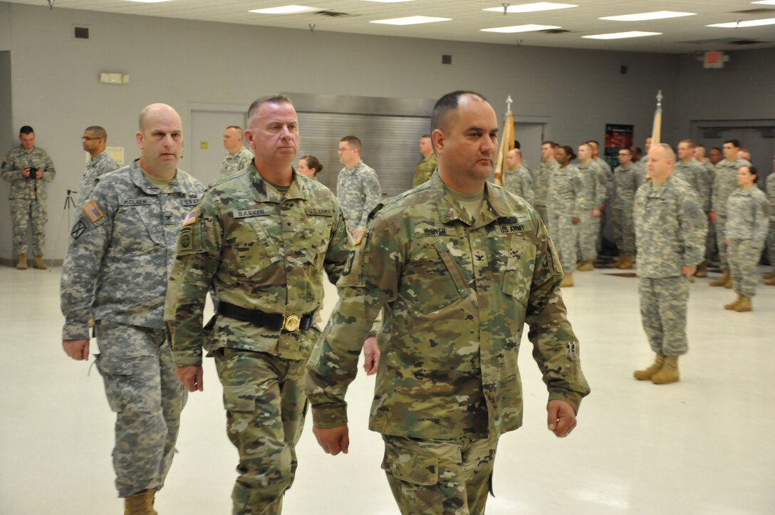 Army Reserve Col. Stephen R. Smith, incoming 643rd Regional Support Group commander, followed by Brig. Gen. Vincent B. Barker, commanding general of the 310th Sustainment Command (Expeditionary), and Col. William J. McLaen, outgoing commander of the 643rd RSG march to the side of formation as the change of command ceremony of the 643rd RSG is completed, April 9, at the unit’s Whitehall, Ohio, Army Reserve Center headquarters.