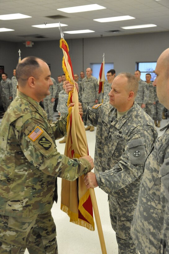 Army Reserve Col. Stephen R. Smith, incoming 643rd Regional Support Group commander, accepts the colors from Command Sgt. Maj. Scott A. Hinton, 643rd RSG senior enlisted advisor, during a change of command ceremony April 9, at the unit’s Whitehall, Ohio, Army Reserve Center headquarters. Smith, formerly the chief of staff for the 310th Sustainment Command (Expeditionary), is taking over command of the 643rd RSG from Col. William J. McLaen.