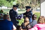Senior Airman Adam Fiddler and a fellow Joint Base San Antonio Honor Guard member fold an American Flag during a funeral ceremony Oct. 10 at the Fort Sam Houston National Cemetery. The Honor Guard's primary mission is to pay respect to fallen service members and support ceremonial functions. 