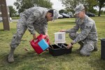 Senior Airmen Timothy Legge (left) and Ernesto Arguelles Jr., 359th Aerospace Medicine Squadron public health technicians, set a mosquito trap April 7 at Joint Base San Antonio-Randolph. When samples are collected, female mosquitoes are separated from the males and sent to the Army Public Health Command Central at JBSA-Fort Sam Houston to see if they are carrying disease-causing viruses. 