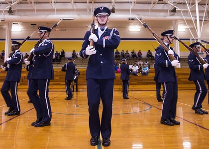 The U.S. Air Force Honor Guard Drill Team performs for ROTC students at Samuel Clemens High School, Schertz, Texas, April 14, 2016. The team can perform drill movements in intricate, constantly changing formations while holding a fully-functional M-1 rifle.