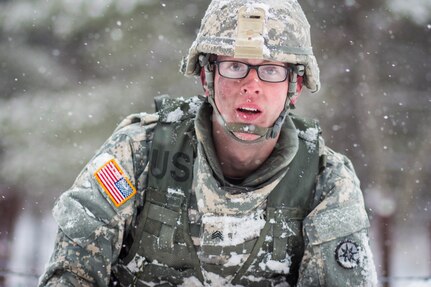 Sgt. John Dana, winner in the non-commissioned officer category, demonstrates an Army Warrior Task as snow falls on the first day of competition of the 377th Theater Sustainment Command Best Warrior Competition. Dana represented the 316th Sustainment Command (Expeditionary) in the competition. Dana, a native of Naugatuck, Conn., was among 11 Soldiers from across the 377th TSC vying for the command’s Best Warrior title and the opportunity to represent the command at the U.S. Army Reserve Command competition at Fort Bragg, N.C. May 1-7, 2016.