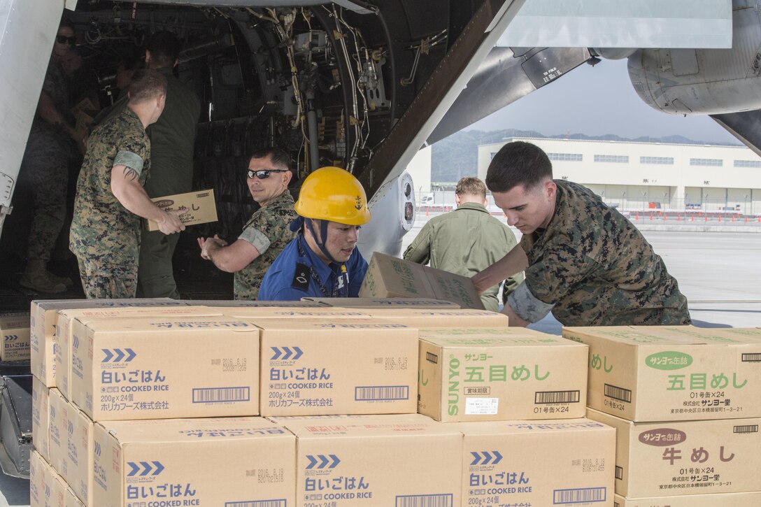 U.S. Marines and Japanese service members load supplies into a U.S. Marine Corps MV-22B Osprey aircraft at Marine Corps Air Station Iwakuni, Japan, April 20, 2016. Marine Corps photo by Cpl. Nathan Wicks