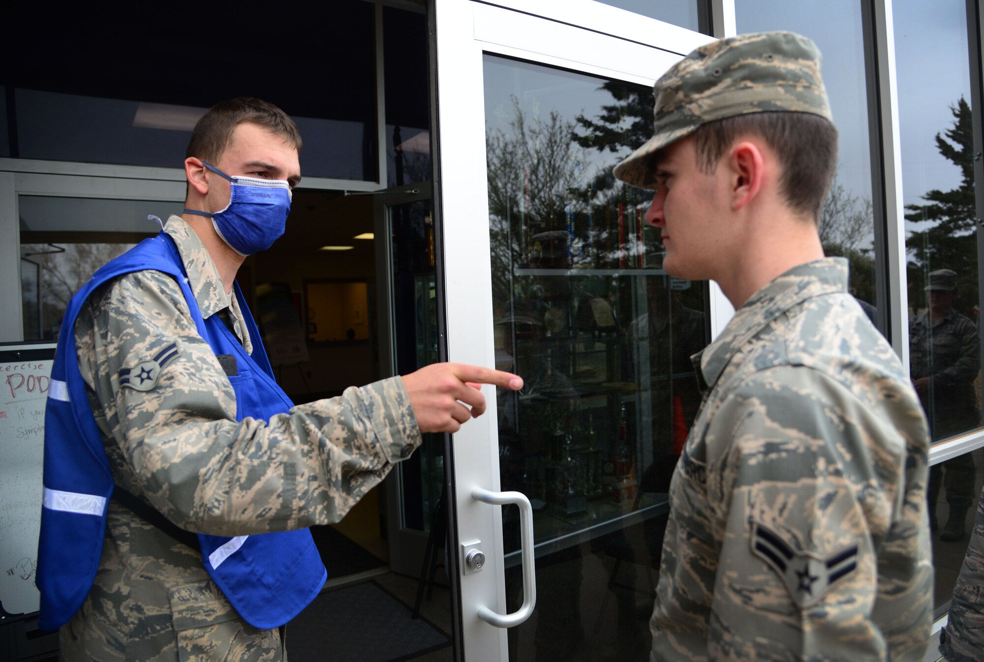 An Air Commando assigned to the 27th Special Operations Wing conducts entry authorization procedures during a base-wide disease containment exercise April 8, 2016, at Cannon Air Force Base, N.M. This statewide exercise is conducted every five years, every two for the Air Force, and aids in the training of health agencies to properly prepare for and respond to potential public health emergencies. (U.S. Air Force photo/Staff Sgt. Alexx Pons) 