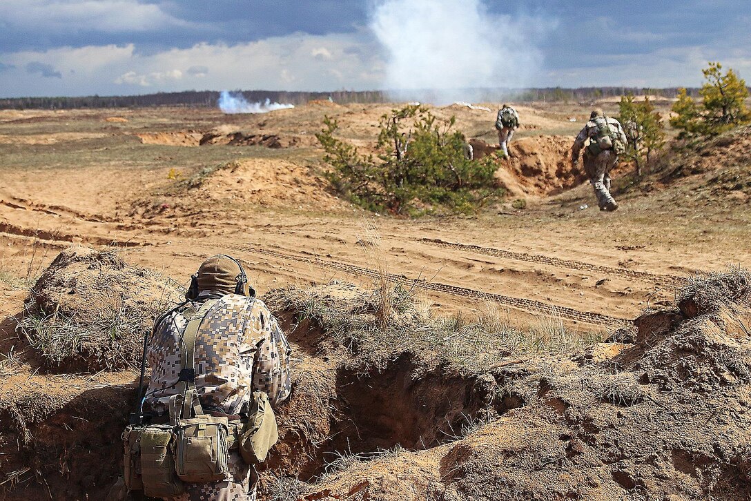 Latvian soldiers move toward a live-fire during a breaking contact and trench clearing exercise as part of Summer Shield XIII at Adazi Military Base, Latvia, April 19, 2016. Army photo by Sgt. Paige Behringer