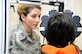 Capt. (Dr.) Roxanne Buffano, an optometrist assigned to the 927th Aerospace Medicine Squadron, MacDill Air Force Base, Florida, examines a patient in Kodiak, Alaska, during Arctic Care 2016. (U.S. Air Force photo by Bo Joyner)