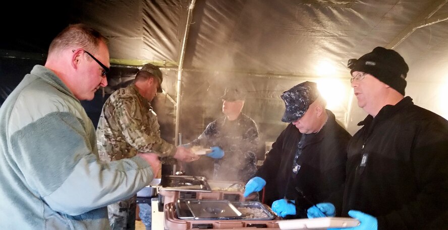 Participants in Arctic Care 2016 are served breakfast prepared in a field kitchen on the Kodiak, Alaska, Coast Guard base. In addition to providing outstanding training for medical professionals and civil engineers, Innovative Readiness Training events like Arctic Care provide real-world training for food service specialists, communications workers and logistics personnel. (Photo courtesy of HMC Ken Staatz, U.S. Navy Reserve)