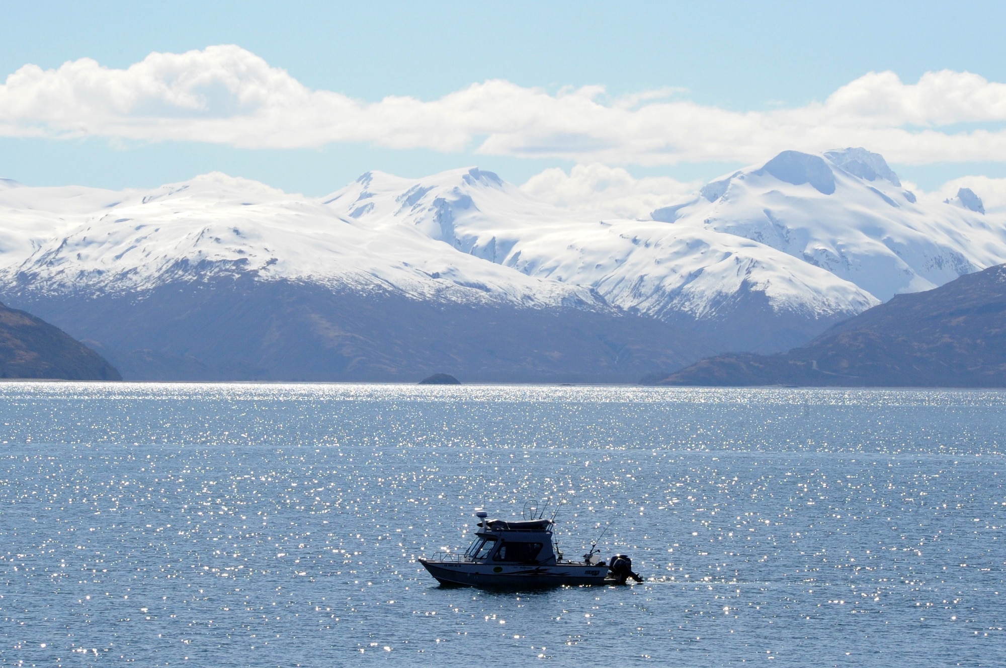 A fishing boat passes by the native village of Port Lions on Kodiak Island in Alaska. Service members from the Air Force, Army and navy provided free dental, medical, optometry and veterinary services in Port Lions and other small Kodiak villages during Arctic Care 2016. (U.S. Air Force photo by Bo Joyner