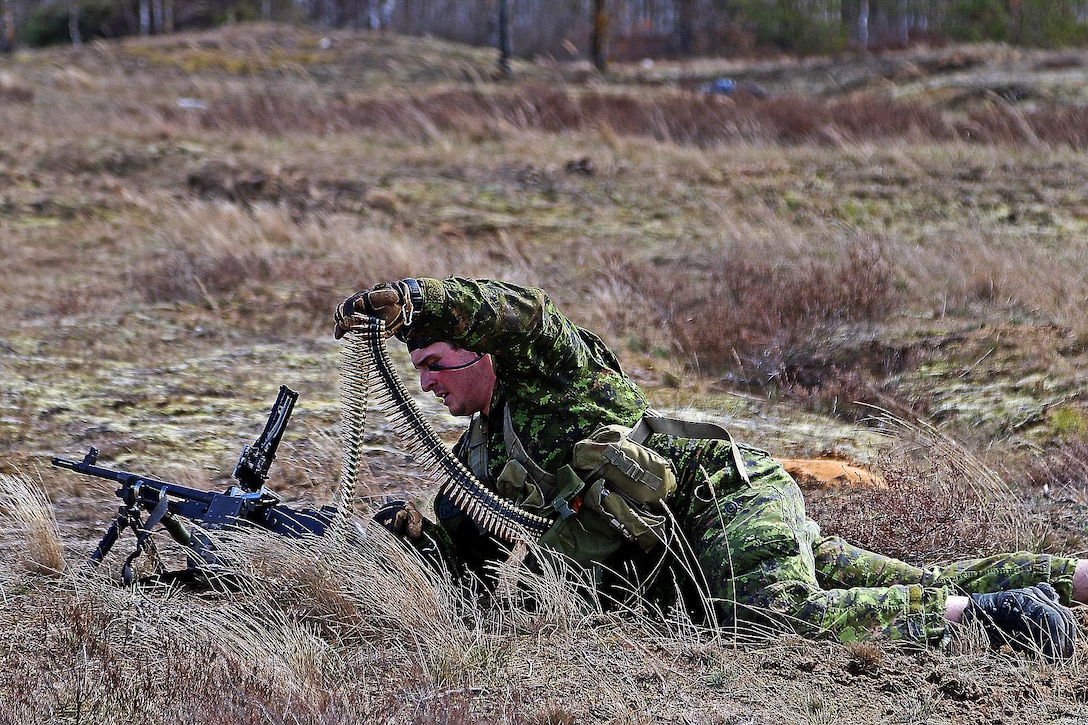 A Canadian soldier reloads during the live-fire portion of a breaking contact and trench clearing exercise as part of Summer Shield XIII at Adazi Military Base, Latvia, April 19, 2016. Army photo by Sgt. Paige Behringer