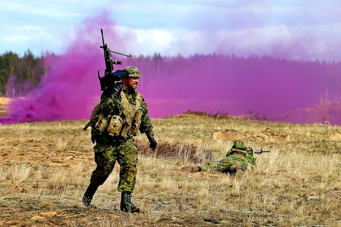A Canadian soldier moves behind smoke concealment during the live-fire portion of a breaking contact and trench clearing exercise,  part of Summer Shield XIII at Adazi Military Base, Latvia, April 19, 2016. Army photo by Sgt. Paige Behringer