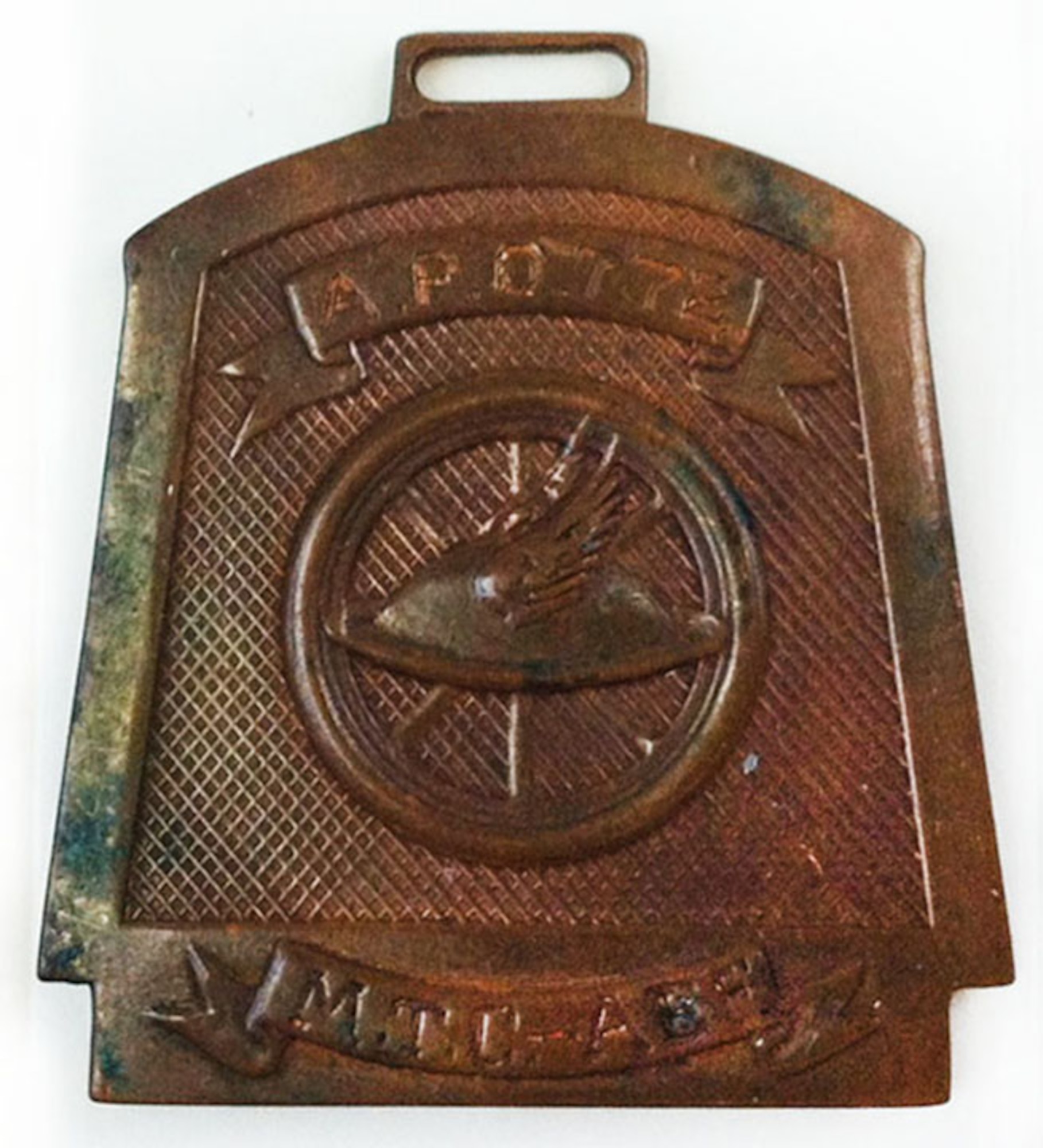 This World War I medallion bears the American Expeditionary Force’s Motor Transport Corps’ emblem of a feather stuck in an infantry helmet, which is in front of a wheel. It is engraved: A.P.O. 772 M.T.C. – AEF. (U.S. Air Force photo)