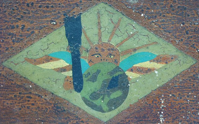 The 166th Aero Squadron served as a day bombardment squadron on the Western Front during World War I. The design the of squadron’s emblem is a sun rising up from behind the Earth positioned with Europe displayed and a bomb falling towards enemy territory; the Earth is also flanked by an American flag on each side. (U.S. Air Force photo)